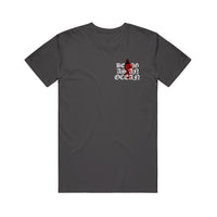 image of the front of a charcoal tee shirt on a white background. tee has a small chest print on the right of a red grim reaper. in white around it says being as an ocean.