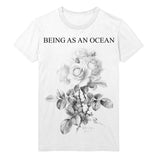 image of a white tee shirt on a white background. tee has full body print in black that says at the top, being as an ocean, with roses below