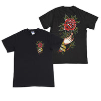 image of the front and back of a black tee shirt on a white background. front of the tee is on the right and has a small chest print on the right of a red flower with green leaves and a yellow banner around the stem that says being as an ocean. the back of the tee is on the right and has a full back print of a hand holding a red flower and a yellow banner around the hand that says heart on my sleeve