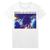 image of white tee shirt on a white background. tee has full chest print. in black on top says being as an ocean with a blurry image of a band playing with a crowd in blue and purple tones.